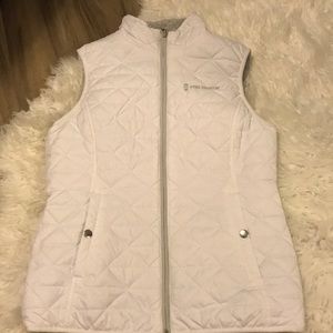 White winter vest with grey stuffing inside